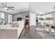 Open-concept living space with dining area, living room, and kitchen featuring hardwood floors at 3907 Stillwood Dr., Myrtle Beach, SC 29588