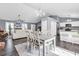 Open-concept living area with dining table adjacent to a living room and modern kitchen at 3907 Stillwood Dr., Myrtle Beach, SC 29588