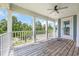 Covered back porch with ceiling fan and views of the surrounding landscape at 3925 Riley-Hampton Dr., Myrtle Beach, SC 29579