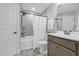 Well-lit bathroom with shower and gray vanity at 3925 Riley-Hampton Dr., Myrtle Beach, SC 29579