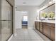 Bathroom featuring stylish vanity, large mirror, and glass-enclosed shower at 3925 Riley-Hampton Dr., Myrtle Beach, SC 29579