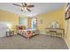 Bright bedroom featuring vibrant accents, a patterned bedspread, and a charming vanity at 3925 Riley-Hampton Dr., Myrtle Beach, SC 29579