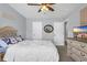 Cozy bedroom with a bed, dresser, wall mounted television and neutral carpet at 3925 Riley-Hampton Dr., Myrtle Beach, SC 29579