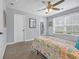 Bright bedroom with ceiling fan and access to a private balcony at 3925 Riley-Hampton Dr., Myrtle Beach, SC 29579