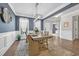 Bright dining area featuring a rustic wood table, natural light, and elegant decor at 3925 Riley-Hampton Dr., Myrtle Beach, SC 29579