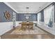 Elegant dining room with a large wood table, statement chandelier, and wainscoting at 3925 Riley-Hampton Dr., Myrtle Beach, SC 29579