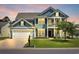 Charming two-story home with a well-manicured lawn, two car garage, and inviting front porch and a balcony above at 3925 Riley-Hampton Dr., Myrtle Beach, SC 29579