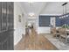 Welcoming foyer with hardwood floors, wainscoting, and an open view into the dining room and living spaces at 3925 Riley-Hampton Dr., Myrtle Beach, SC 29579