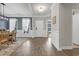 Bright foyer with hardwood floors leading to a dining area, featuring a statement chandelier and natural light at 3925 Riley-Hampton Dr., Myrtle Beach, SC 29579