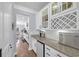 Kitchenette with granite countertops, subway tile backsplash, and glass-front cabinets at 3925 Riley-Hampton Dr., Myrtle Beach, SC 29579