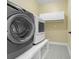 Laundry room features modern washer and dryer with overhead cabinets at 3925 Riley-Hampton Dr., Myrtle Beach, SC 29579