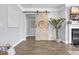 Stylish living room featuring a sliding barn door and contemporary decor at 3925 Riley-Hampton Dr., Myrtle Beach, SC 29579