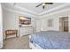 Bright main bedroom with large dresser, ceiling fan, and wall-mounted television at 3925 Riley-Hampton Dr., Myrtle Beach, SC 29579