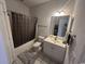 Clean and functional bathroom with a shower-tub combo, vanity, and tiled floor at 3965 Forsythia Ct. # 202, Myrtle Beach, SC 29588