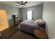 Cozy bedroom with neutral tones, laminate wood flooring, and ceiling fan, offering comfort at 3965 Forsythia Ct. # 202, Myrtle Beach, SC 29588