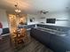 Open-concept living room with a dining area and modern sectional sofa, perfect for entertaining at 3965 Forsythia Ct. # 202, Myrtle Beach, SC 29588