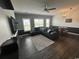 Comfortable living room featuring a large sectional sofa, ceiling fan, and laminate flooring at 3965 Forsythia Ct. # 202, Myrtle Beach, SC 29588