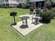 Back patio area with grill and seating at 3965 Forsythia Ct. # 202, Myrtle Beach, SC 29588