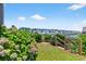 Backyard with a short path to the water, lined with flowers and lush greenery, to a dock at 401 Marlin St., Sunset Beach, NC 28468