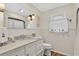 Elegant bathroom with white marble countertop, updated fixtures, and nautical decor, exuding coastal charm at 401 Marlin St., Sunset Beach, NC 28468