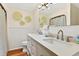 Modern bathroom featuring double sinks, white cabinets, and stylish decor at 401 Marlin St., Sunset Beach, NC 28468