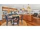 Open kitchen featuring wood cabinets, a center island, and eat in table with seating at 401 Marlin St., Sunset Beach, NC 28468