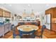 Open concept kitchen featuring wooden cabinets, an island, and views of the living room at 401 Marlin St., Sunset Beach, NC 28468