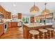 This well-lit kitchen features wood cabinets, stainless steel appliances, and bar stool seating at 401 Marlin St., Sunset Beach, NC 28468