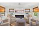 Cozy living room with fireplace, comfortable seating, and scenic water views at 401 Marlin St., Sunset Beach, NC 28468
