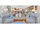Spacious living room with an open layout, comfortable seating, and hardwood floors at 401 Marlin St., Sunset Beach, NC 28468