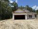 An exterior view of a house under construction with an attached two-car garage at 4032 Copperhead Rd., Conway, SC 29527