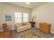 Cozy bedroom with neutral tones, comfortable seating, and natural light at 435 Rollins Dr., Longs, SC 29568