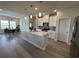 Bright kitchen featuring a large island, stainless steel appliances, and a view into the dining area at 435 Rollins Dr., Longs, SC 29568