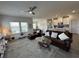 Open living area flowing into the kitchen with comfortable seating and modern lighting at 435 Rollins Dr., Longs, SC 29568