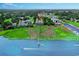 Breathtaking aerial view of the property, showcasing its waterfront location with a private pier and boat dock at 4355 Rivergate Ln. # F, Little River, SC 29566