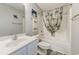 Cozy bathroom featuring a shower-tub combo with a stylish palm leaf shower curtain and gray-tone flooring at 4355 Rivergate Ln. # F, Little River, SC 29566