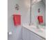 Bright bathroom featuring a white vanity, flamingo wall art, and a decorative mirror border at 4355 Rivergate Ln. # F, Little River, SC 29566