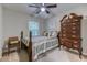 Bedroom featuring a bed with decorative pillows and bedspread and a tall dresser at 4355 Rivergate Ln. # F, Little River, SC 29566