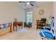 Well-lit bedroom/office featuring neutral carpet, a ceiling fan, and a window that offers pleasant natural light at 4355 Rivergate Ln. # F, Little River, SC 29566