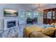 Cozy living area featuring a fireplace, dining set, and natural light at 4355 Rivergate Ln. # F, Little River, SC 29566