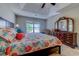 Main bedroom features a large window, decorative seashell bedding and dark wood furniture at 4355 Rivergate Ln. # F, Little River, SC 29566
