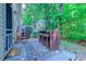 Outdoor patio featuring a tall table with stools, surrounded by lush greenery for a private backyard feel at 4355 Rivergate Ln. # F, Little River, SC 29566