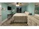 Cozy bedroom with neutral tones, ceiling fan, and a sliding glass door to a balcony at 4522 N Plantation Harbour Dr. # E7, Little River, SC 29566