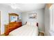 Comfortable bedroom with a ceiling fan and a dresser with mirror at 4522 N Plantation Harbour Dr. # E7, Little River, SC 29566