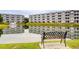 Scenic view of condos overlooking a pond with a fountain and a bench in the foreground at 4522 N Plantation Harbour Dr. # E7, Little River, SC 29566