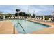 Community swimming pool with plenty of lounge chairs for relaxing by the water at 4522 N Plantation Harbour Dr. # E7, Little River, SC 29566