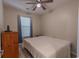 Neutral bedroom with a ceiling fan, window, and standard closet space at 468 River Oak Dr. # 66D, Myrtle Beach, SC 29579