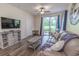 Comfortable living room with sliding glass doors leading to the outside patio at 468 River Oak Dr. # 66D, Myrtle Beach, SC 29579