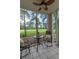 Screened patio featuring a table and chairs overlooking the golf course at 468 River Oak Dr. # 66D, Myrtle Beach, SC 29579