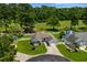 Aerial view of a single-Gathering home with a well-maintained lawn and white picket fence at 483 Oakmont Dr., Myrtle Beach, SC 29579